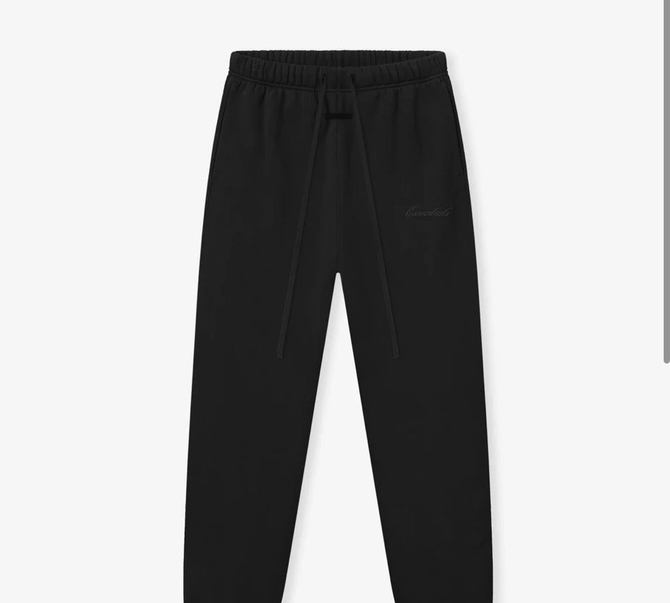 FEAR OF GOD Essentials pants. Colored black.