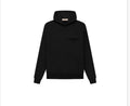 FEAR OF GOD Essentials hoodie. Colored black.